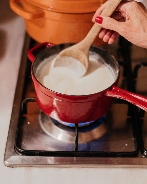 Heat up 6-8oz of milk or water (we like coconut or goat milk)